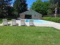 Inviting pool area with lounge chairs and a covered pool house, perfect for relaxing and enjoying the outdoors at 14740 E Kentucky Dr # 725, Aurora, CO 80012