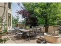 Charming outdoor dining area with a built-in grill and fire pit, perfect for entertaining at 9311 E Star Hill Trl, Lone Tree, CO 80124