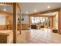 Spacious living area with natural light, wood accents, and scenic outdoor views at 29266 S Sunset Trl, Conifer, CO 80433