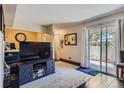 Bright living room with sliding glass doors, paired with neutral tones and a contemporary design for relaxation at 4643 S Lowell Blvd # B, Denver, CO 80236