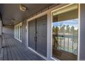 Covered porch leading to a striking front door and a sidelight window at 8446 Lightening View Dr, Parker, CO 80134