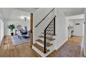 Bright staircase with a modern black metal railing leading to the second floor at 8446 Lightening View Dr, Parker, CO 80134