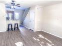 Open living and kitchen area with breakfast bar at 15475 E Louisiana Ave, Aurora, CO 80017