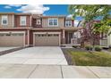 Charming home featuring a two-car garage and well-manicured lawn during daytime at 17848 Gallup St, Broomfield, CO 80023
