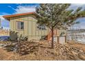 Charming home with a two-car garage, wooden stairs, neutral paint, and a picturesque view of surrounding nature at 97 Hedges Cir, Sedalia, CO 80135