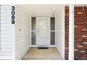 Close-up of the home's front door and porch, showing the house number at 3089 S Quintero Way, Aurora, CO 80013