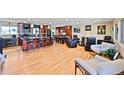 Spacious living room with hardwood floors, opening up to a beautifully renovated open kitchen at 2194 S Braun Way, Lakewood, CO 80228