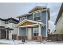 Two-story house with blue siding, brick accents, and a front yard at 958 Superior Dr, Superior, CO 80027