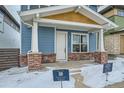 Front view of a two-story blue house with a covered porch at 958 Superior Dr, Superior, CO 80027
