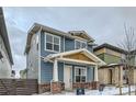 Two-story house with blue siding, and a brick facade at 958 Superior Dr, Superior, CO 80027