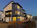Modern two-story home displaying a contemporary architectural design and beautiful landscaping around the property at 2446 W 167Th Ln, Broomfield, CO 80023