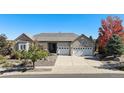 Inviting single-story home with a three-car garage and beautiful landscaping at 5924 S Kittredge St, Centennial, CO 80016
