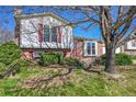 Charming single-Gathering home with a well-maintained lawn, brick accents, and an attached two-car garage at 1796 S Yampa Way, Aurora, CO 80017