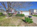 Charming single-Gathering home with a well-maintained lawn, brick accents, and an attached two-car garage at 1796 S Yampa Way, Aurora, CO 80017