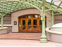 Elegant building entrance with decorative archway and inviting wooden doors at 400 E 3Rd Ave # 305, Denver, CO 80203