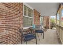 Relaxing front porch with seating area, perfect for enjoying the outdoors at 7291 E Bentley Cir, Centennial, CO 80122