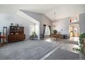 Bright and airy living room with vaulted ceilings and an open-concept design at 7345 S Eagles Nest Cir, Littleton, CO 80127