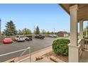 Convenient parking lot view with multiple vehicles and verdant landscaping at 14700 E 104Th Ave # 2802, Commerce City, CO 80022