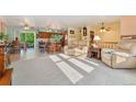 Bright and spacious living room with comfortable seating and views of the kitchen at 5870 Quail St, Arvada, CO 80004