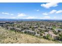 Expansive aerial view of condos highlighting the community's serene location and stunning mountain views at 13850 E Marina Dr # 304, Aurora, CO 80014