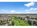 Beautiful aerial view of condos neighboring a golf course in a scenic community at 13850 E Marina Dr # 304, Aurora, CO 80014