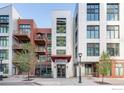 Jack Kerouac Lofts building showcasing a contemporary exterior with balconies and unique architectural details at 3100 Huron St # 3P, Denver, CO 80202