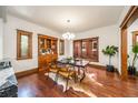 Dining area with hardwood floors, a cowhide rug, and a built-in wooden cabinet at 1440 Saint Paul St, Denver, CO 80206