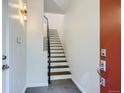 Bright entryway with modern staircase and tile flooring at 2345 Walnut St # 24, Denver, CO 80205