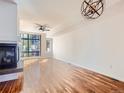 Open living area with hardwood floors and fireplace at 2345 Walnut St # 24, Denver, CO 80205