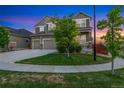 Charming two-story home with a three car garage and landscaped yard at 10003 Atlanta St, Parker, CO 80134