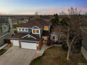 Beautiful two-story home with a three-car garage situated on a landscaped lot at 10103 Knoll Cir, Highlands Ranch, CO 80130