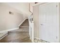 Carpeted stairway with white railing leading to the upper level of the home at 4903 W 73Rd Ave, Westminster, CO 80030