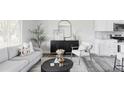 Bright living room boasts modern decor, a comfortable seating area, and an open floor plan at 1561 W Beekman Pl, Denver, CO 80221