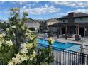 This community pool has a pergola and nice seating area, with attractive landscaping at 15274 W 64Th Ln # 206, Arvada, CO 80007