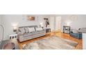 Cozy living room with a plush sofa, hardwood floors, and stylish decor, creating a welcoming atmosphere at 1151 N Marion St # 104, Denver, CO 80218