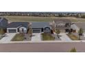 A quiet street featuring single-story homes with manicured lawns at 95 S Edge Cliff St, Castle Rock, CO 80104