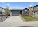 Charming single-story home with a well-maintained lawn and a two-car garage at 95 S Edge Cliff St, Castle Rock, CO 80104