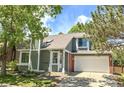 Charming two-story home featuring a well-maintained lawn and a two-car garage at 944 E Lily Ct, Highlands Ranch, CO 80126