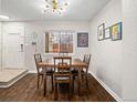 Dining area features a window, modern lighting, and seating for four at 1060 S Parker Rd # 19, Denver, CO 80231