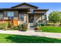 Modern home's exterior with landscaping, walkway, and a charming entrance at 48 Newport St, Denver, CO 80230