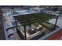 Stunning rooftop deck with comfortable seating and a charming pergola providing shade and style at 1510 Wazee St # 3, Denver, CO 80202