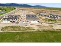 An aerial view of a new construction neighborhood with mountain views at 17117 W 91St Ln, Arvada, CO 80007