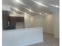 Open concept kitchen features stainless appliances, eat-in bar, and abundant lighting at 17117 W 91St Ln, Arvada, CO 80007