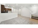 Spacious living room features plush carpeting and white walls at 17117 W 91St Ln, Arvada, CO 80007