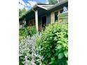This beautiful home features lush landscaping and a charming covered porch entrance at 1315 Tipperary St, Boulder, CO 80303