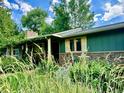 Attractive home with a beautifully landscaped yard and a welcoming covered entryway at 1315 Tipperary St, Boulder, CO 80303