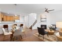 Bright living room with hardwood floors, fireplace, and open floor plan at 8251 W 54Th Ave # 4, Arvada, CO 80002