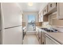 Functional kitchen featuring ample counter space and storage for cooking needs at 3662 S Granby Way # J05, Aurora, CO 80014