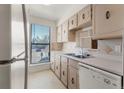 Cozy kitchen with plenty of counter space and natural light from the window at 3662 S Granby Way # J05, Aurora, CO 80014