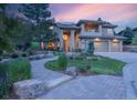 Charming two-story home with professionally landscaped yard, stone path and covered entry at 6338 Spotted Fawn Run, Littleton, CO 80125